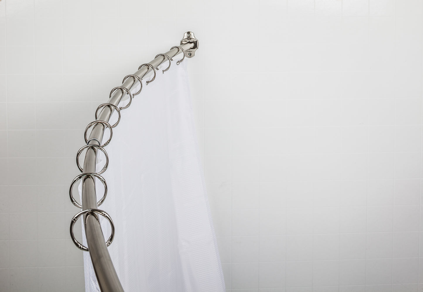 Jeffrey Alexander 56"-72" Bronze Adjustable Curved Shower Curtain Rod  By Hardware Resources - Luxe Bathroom Vanities