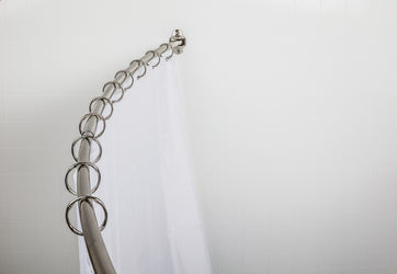 Jeffrey Alexander 56"-72" Bronze Adjustable Curved Shower Curtain Rod  By Hardware Resources - Luxe Bathroom Vanities